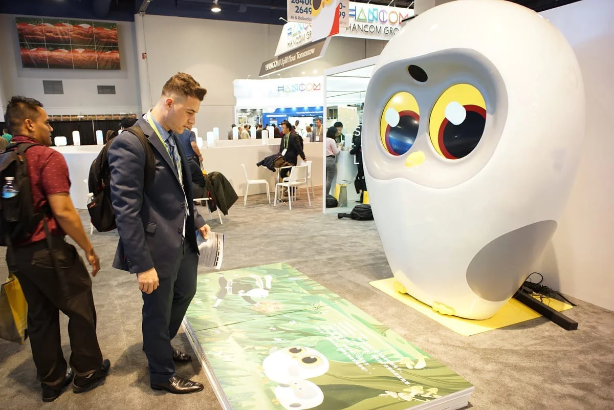 Giant Luka owl display at a trade show